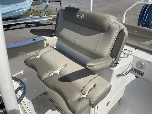 Slide: The Image of 2021 Key West 239 FS boat seating with beige upholstery and armrests. - 18