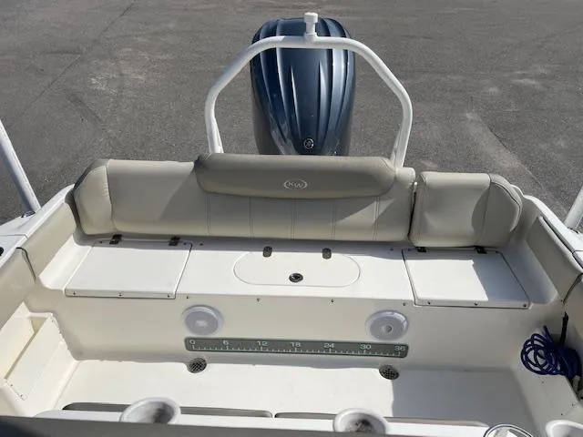 Slide: The Image of 2021 Key West 239 FS boat interior with seating and storage compartments. - 19
