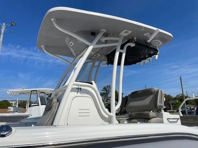 Slide: The Image of 2021 Key West 239 FS boat with T-top and seating, under clear blue sky. - 3
