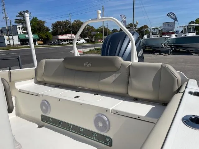Slide: The Image of 2021 Key West 239 FS boat interior with cushioned seating and speakers. - 7