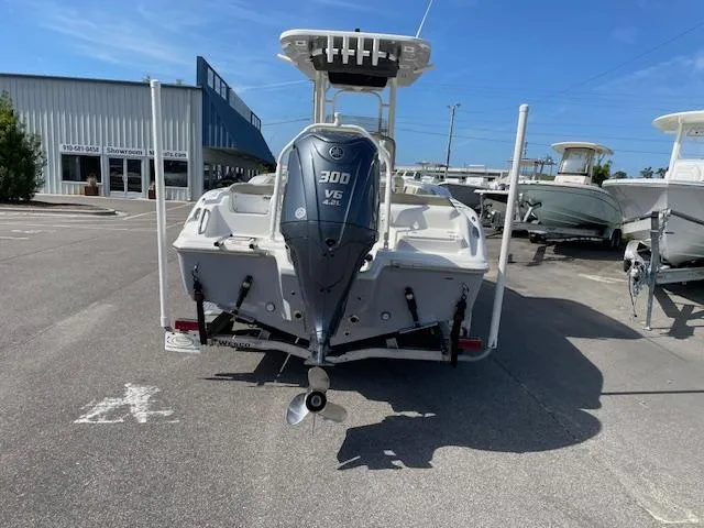 Slide: The Image of 2021 Key West 239 FS boat with Yamaha 300 V6 engine, parked outdoors. - 8