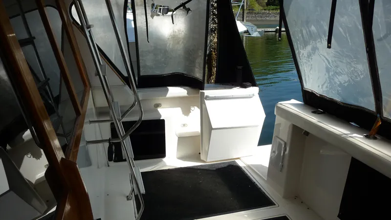 Slide: The Image of 1995 Bayliner 4788 Pilot House Motoryacht interior with seating and water view. - 10