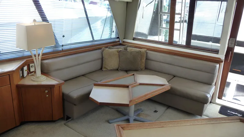 Slide: The Image of Luxurious interior of 1995 Bayliner 4788 Pilot House Motoryacht with plush seating and elegant decor. - 12