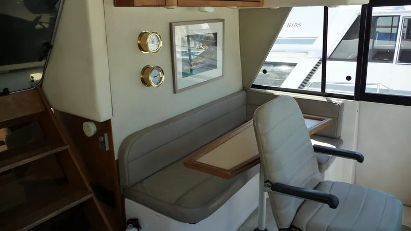 Slide: The Image of Interior of 1995 Bayliner 4788 Pilot House Motoryacht with seating and nautical decor. - 20