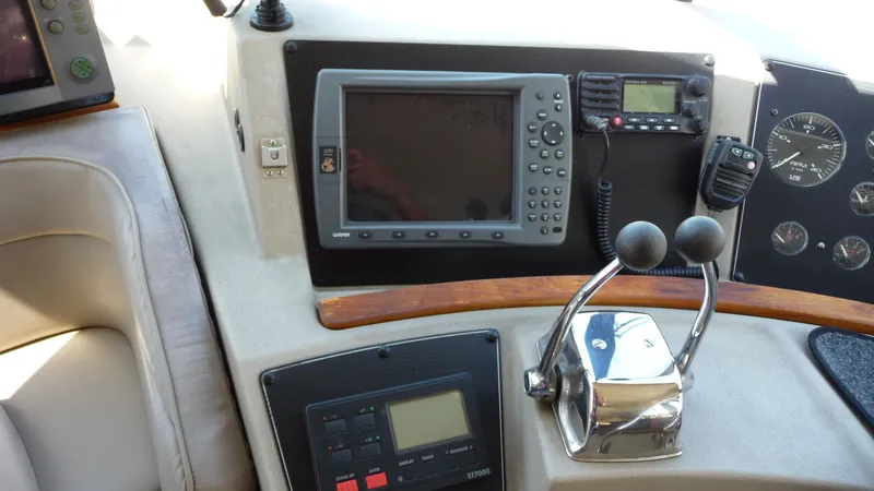 Slide: The Image of 1995 Bayliner 4788 Pilot House Motoryacht dashboard with navigation and control instruments. - 21