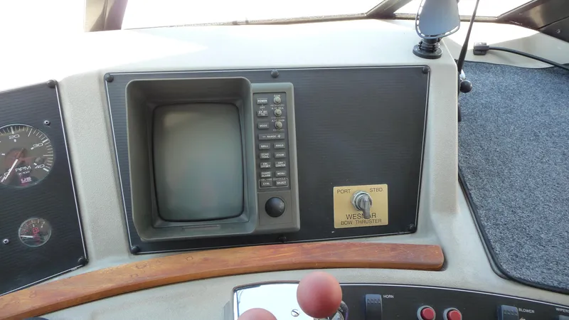 Slide: The Image of 1995 Bayliner 4788 Pilot House Motoryacht dashboard with vintage navigation equipment. - 24