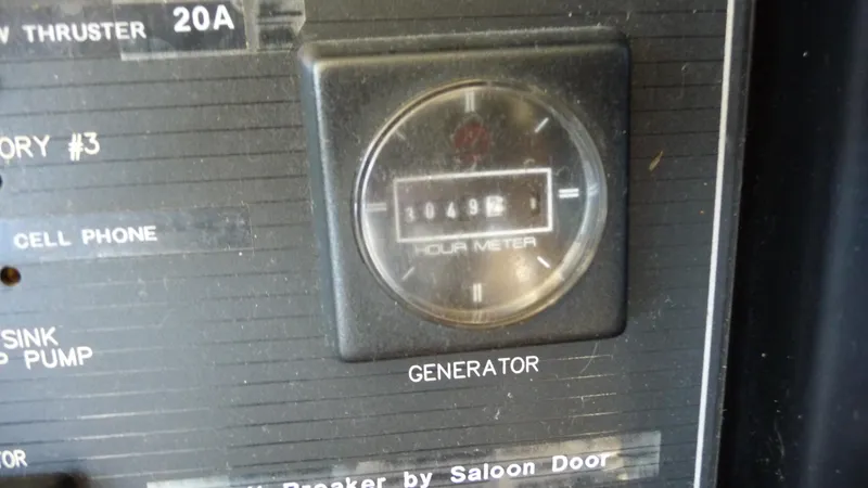 Slide: The Image of Hour meter on 1995 Bayliner 4788 Pilot House Motoryacht generator panel. - 29