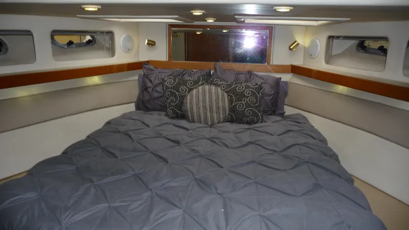 Slide: The Image of Luxurious bedroom interior of 1995 Bayliner 4788 Pilot House Motoryacht with plush bedding. - 32