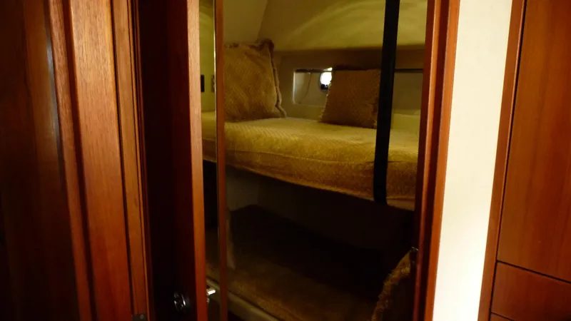 Slide: The Image of Interior cabin of 1995 Bayliner 4788 Pilot House Motoryacht with cozy bunk beds. - 38
