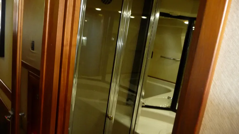 Slide: The Image of Interior of 1995 Bayliner 4788 Pilot House Motoryacht bathroom with glass shower doors. - 47
