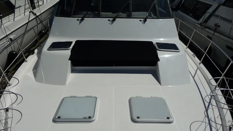 Slide: The Image of 1995 Bayliner 4788 Pilot House Motoryacht deck with hatches and railing. - 6