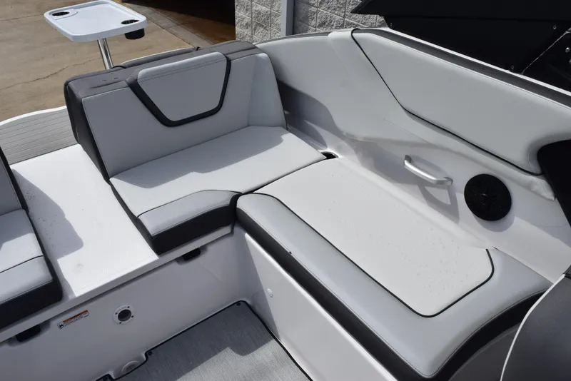 Slide: The Image of 2025 Yamaha Boats AR250 interior seating with sleek, modern design and comfortable upholstery. - 11