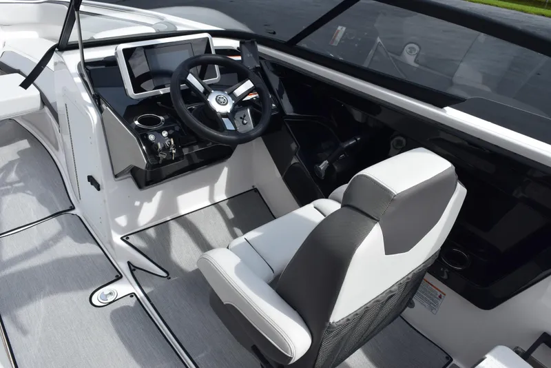 Slide: The Image of 2025 Yamaha Boats AR250 cockpit with modern steering and dashboard design. - 13