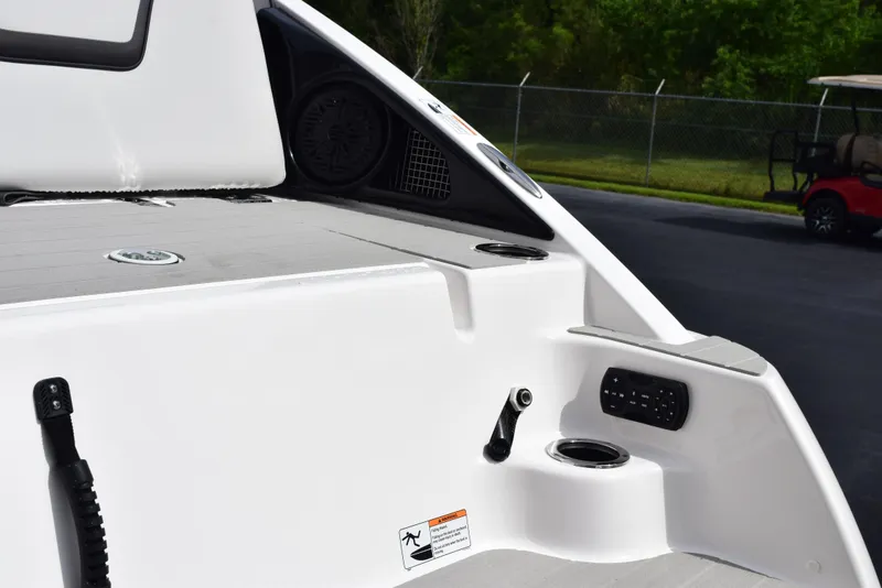 Slide: The Image of 2025 Yamaha Boats AR250 interior detail with speaker and cup holder. - 7