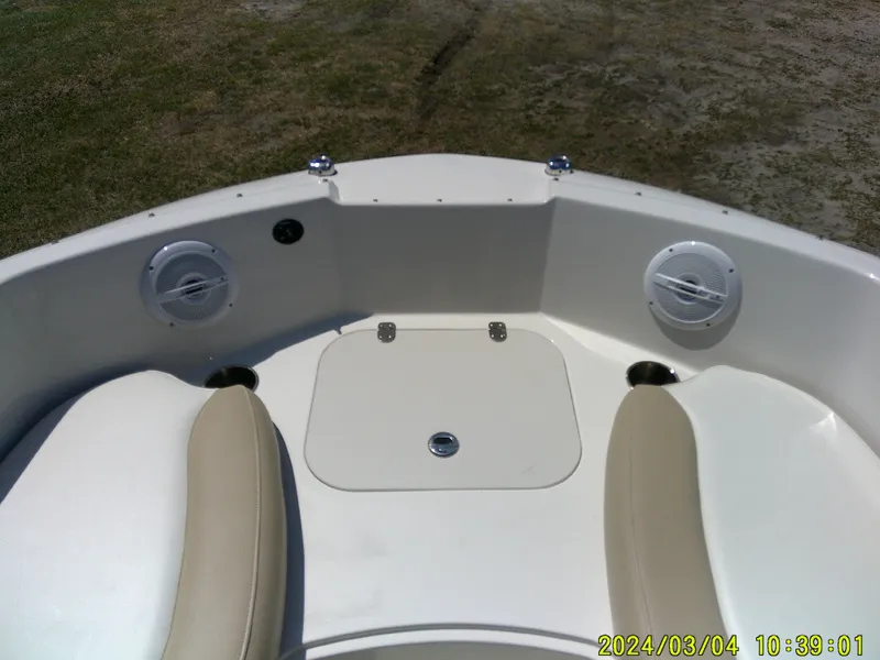 Slide: The Image of 2019 Stingray 191 Dual Console boat interior with seating and speakers. - 12