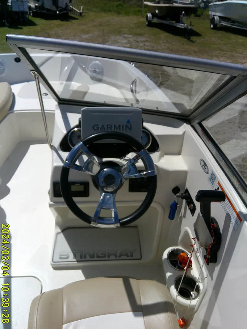 Slide: The Image of 2019 Stingray 191 Dual Console boat dashboard with Garmin navigation system. - 15