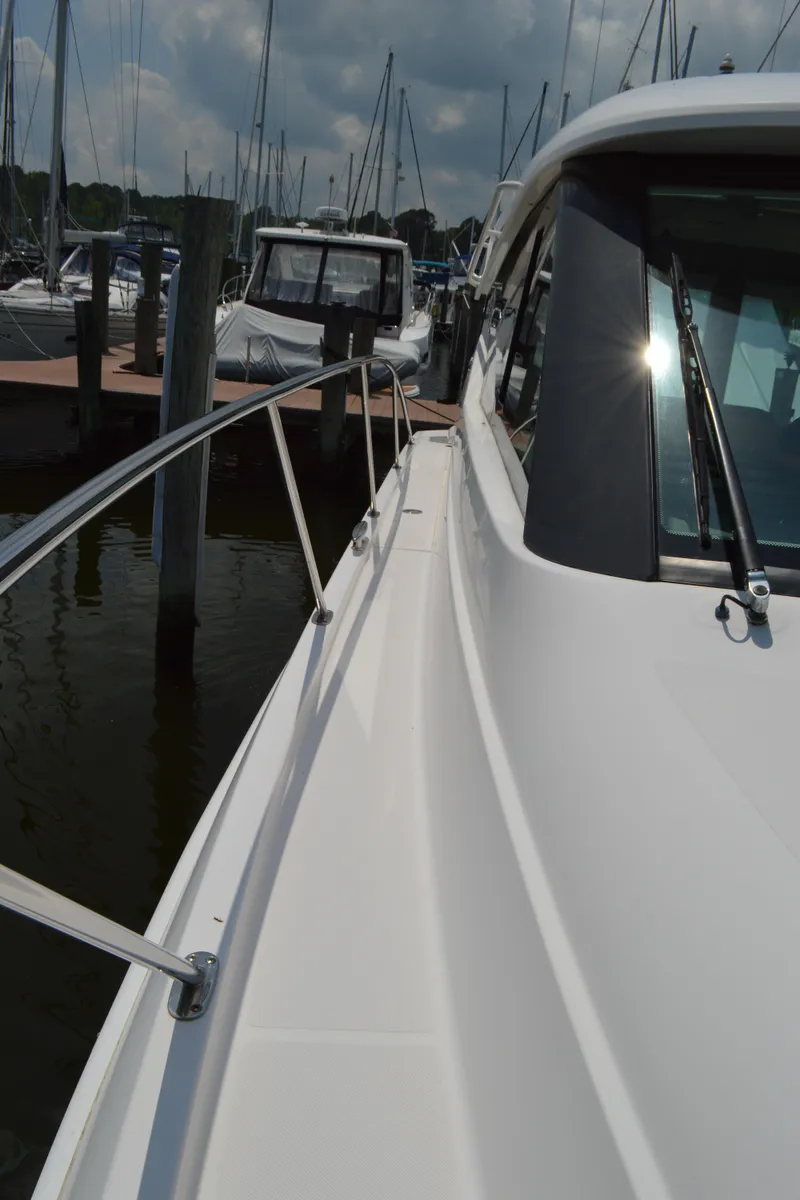 Slide: The Image of 2019 Tiara Yachts C39 Coupe docked, showcasing sleek design and modern features. - 15