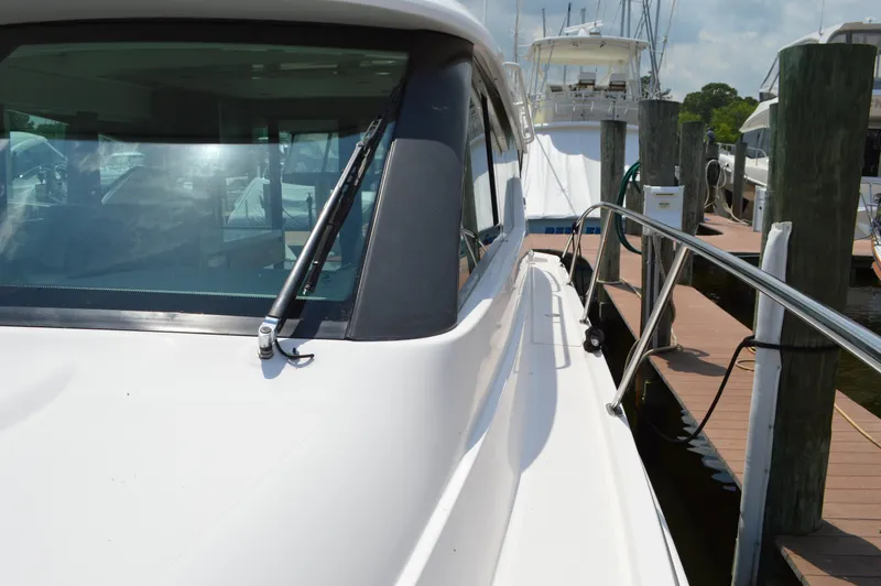 Slide: The Image of 2019 Tiara Yachts C39 Coupe docked, showcasing sleek design and modern features. - 16