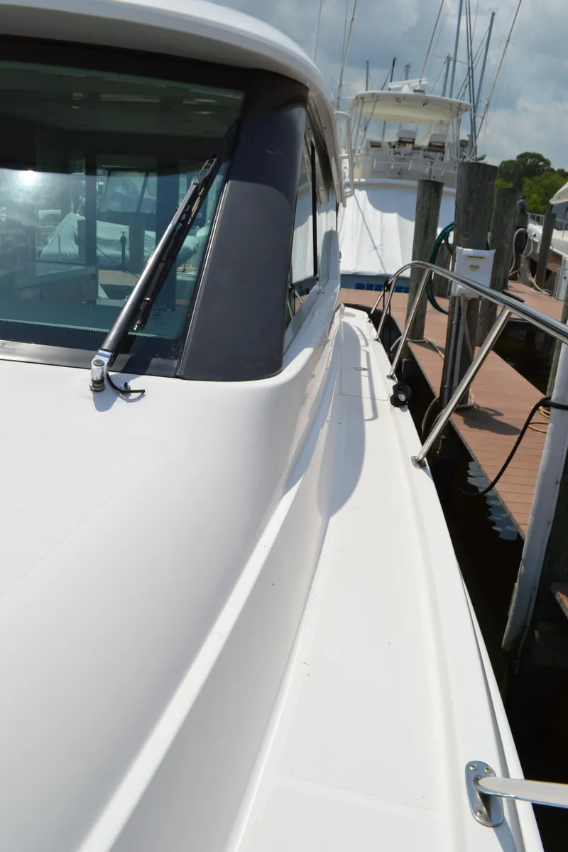 Slide: The Image of 2019 Tiara Yachts C39 Coupe docked, showcasing sleek design and modern features. - 17