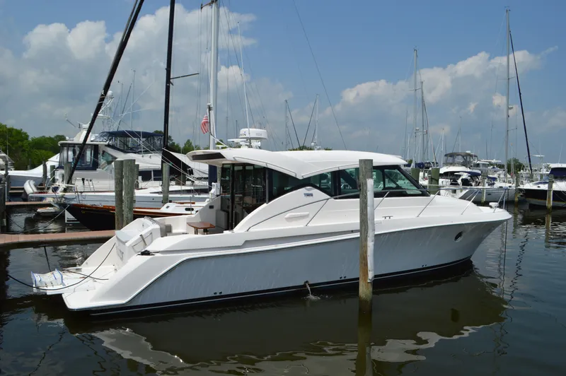 Slide: The Image of 2019 Tiara Yachts C39 Coupe docked at marina under blue sky. - 3