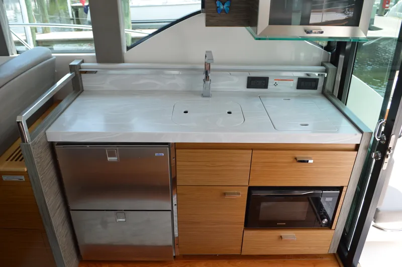 Slide: The Image of Modern kitchen area in 2019 Tiara Yachts C39 Coupe with sleek appliances and cabinetry. - 33