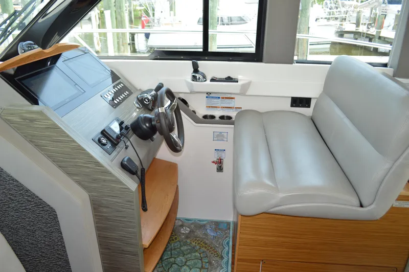 Slide: The Image of 2019 Tiara Yachts C39 Coupe helm with leather seat and modern controls. - 36