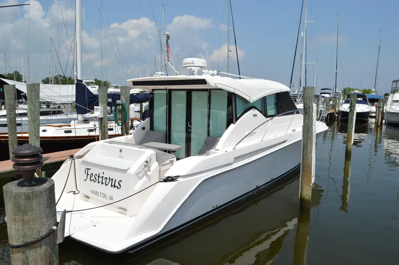 Slide: The Image of 2019 Tiara Yachts C39 Coupe docked in a marina, rear view. - 4
