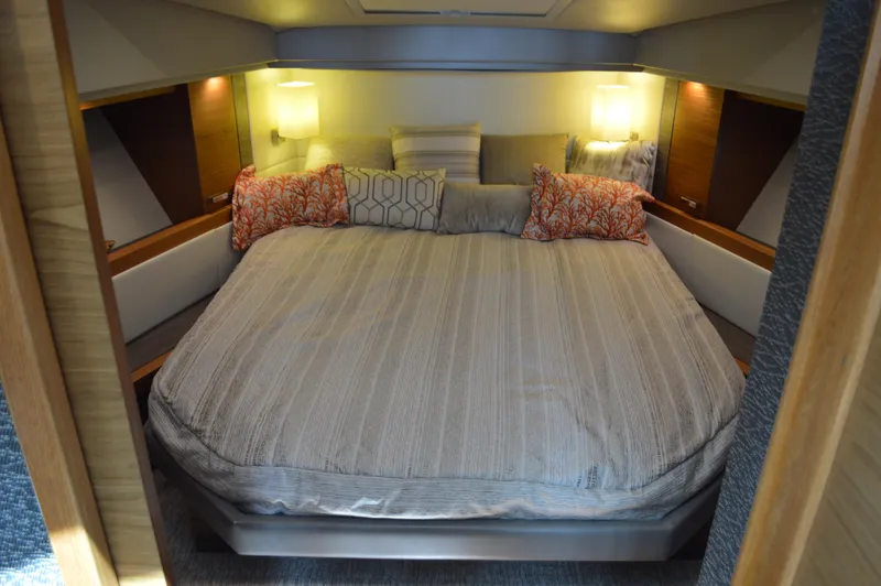 Slide: The Image of Luxurious bedroom interior of 2019 Tiara Yachts C39 Coupe with cozy bedding and ambient lighting. - 41