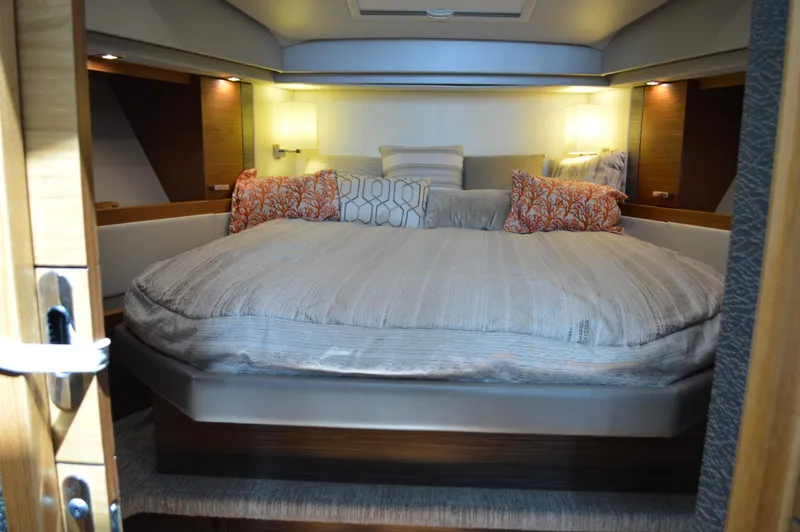Slide: The Image of Luxurious bedroom interior of 2019 Tiara Yachts C39 Coupe with cozy bedding and ambient lighting. - 42