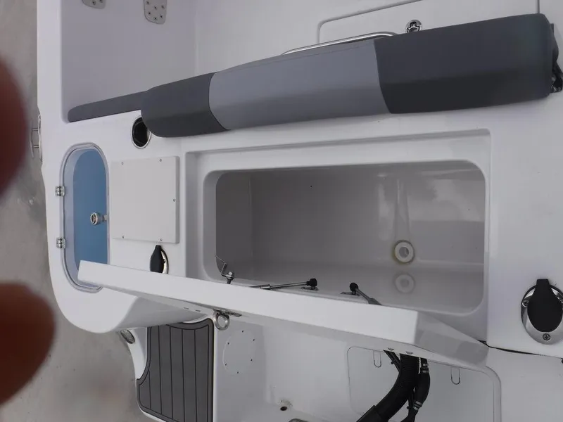 Slide: The Image of 2025 NauticStar 292 Legacy boat interior with storage compartments and seating. - 26