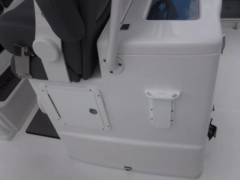 Slide: The Image of 2025 NauticStar 292 Legacy boat interior detail with seating and storage compartment. - 29