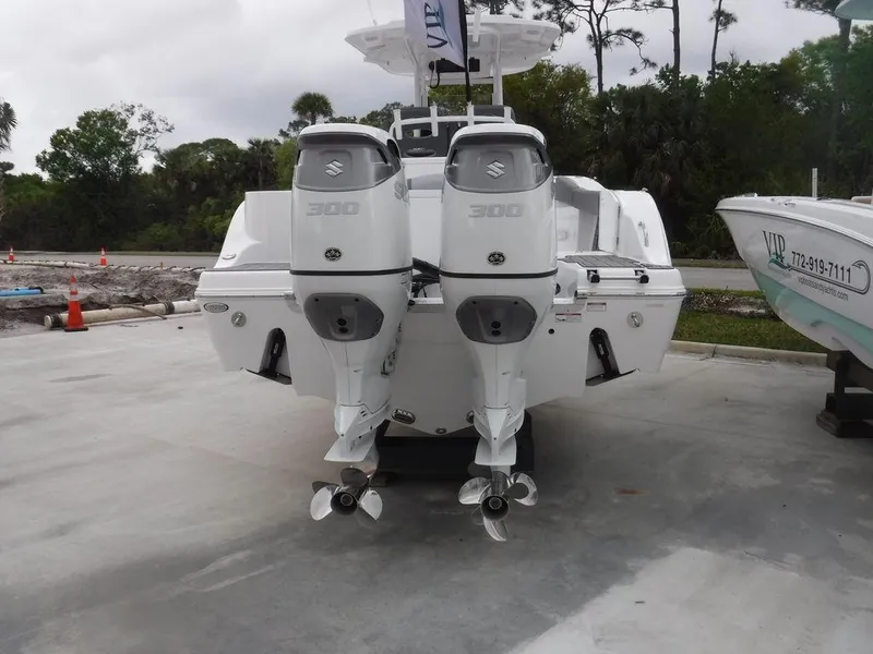 Slide: The Image of 2025 NauticStar 292 Legacy boat on water near marina, sunny day. - 3