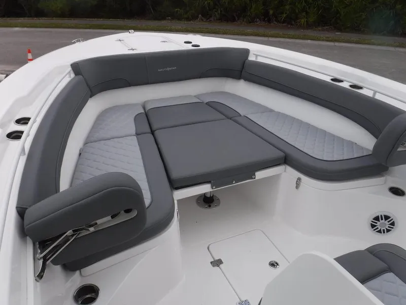 Slide: The Image of 2025 NauticStar 292 Legacy boat with spacious gray seating area. - 35