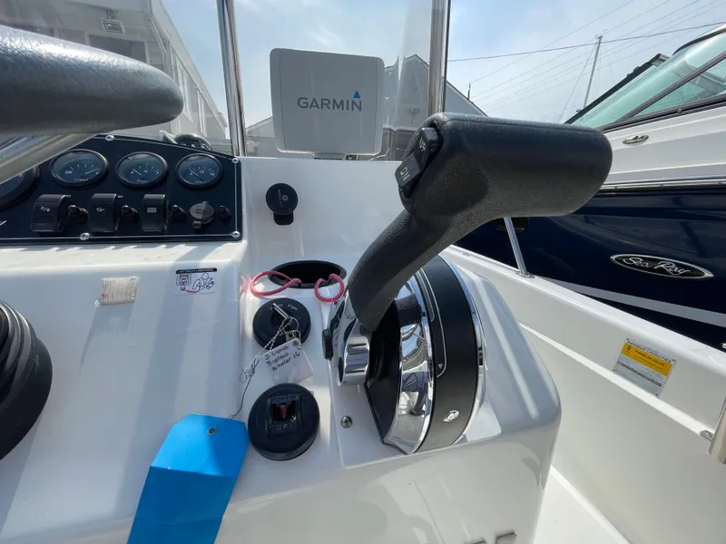 Slide: The Image of 1999 Boston Whaler 16 Dauntless helm with Garmin navigation and control panel. - 10