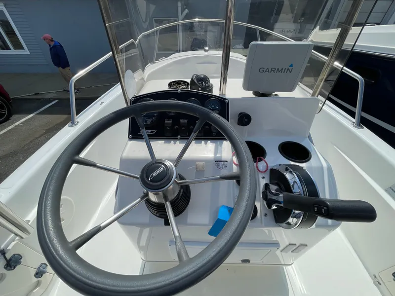 Slide: The Image of 1999 Boston Whaler 16 Dauntless boat helm with Garmin navigation system. - 8
