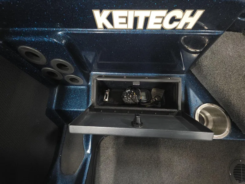 Slide: The Image of 2014 Bass Cat Eyra boat interior with Keitech storage compartment and cup holder. - 10