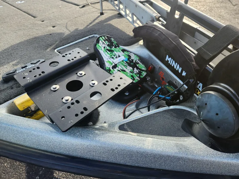 Slide: The Image of 2014 Bass Cat Eyra boat deck with Minn Kota trolling motor and mounting bracket. - 21