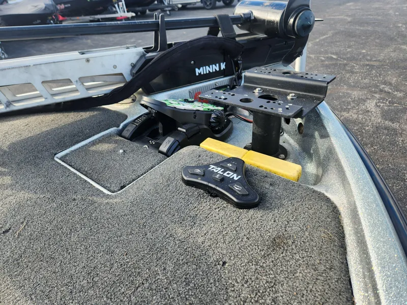 Slide: The Image of 2014 Bass Cat Eyra boat deck with Minn Kota trolling motor and Talon anchor system. - 30