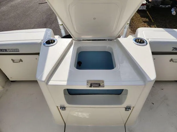 Slide: The Image of 2024 Pathfinder 2700 Open boat with open storage compartment and cup holders. - 14