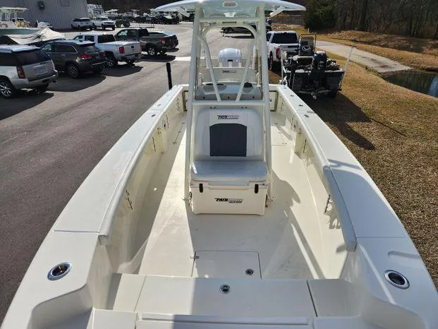 Slide: The Image of 2024 Pathfinder 2700 Open boat, spacious deck, center console, parked outdoors. - 6