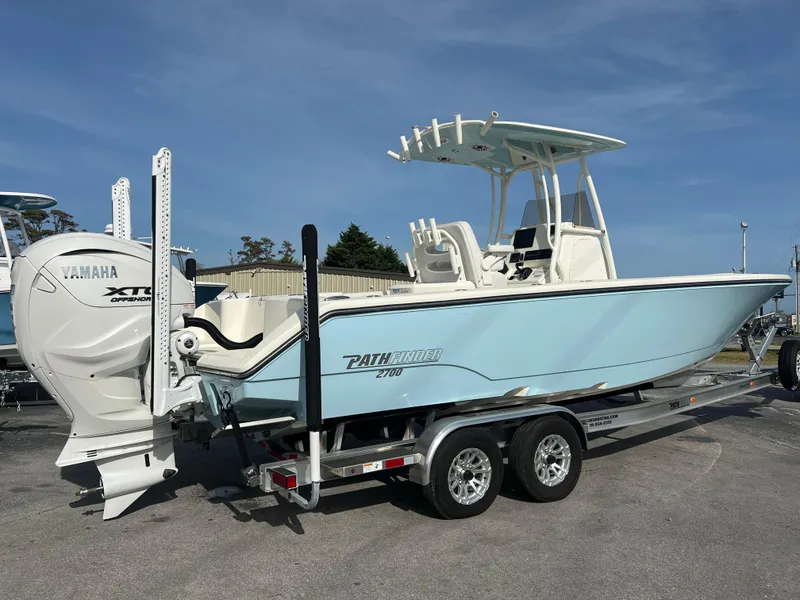 Slide: The Image of 2024 Pathfinder 2700 Open boat on trailer with Yamaha engine, parked outdoors. - 7