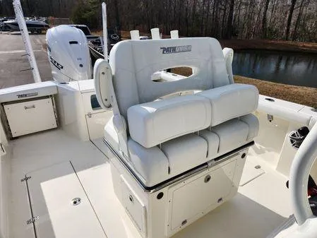 Slide: The Image of 2024 Pathfinder 2700 Open boat interior with cushioned seating and outboard motor. - 9