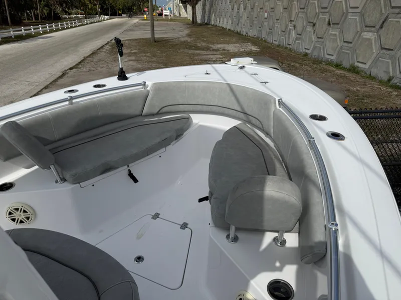 Slide: The Image of 2020 Sportsman Open 232 Center Console boat with gray seating and spacious deck. - 2