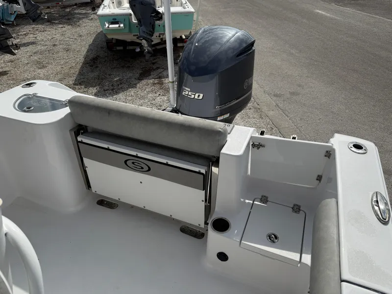 Slide: The Image of 2020 Sportsman Open 232 Center Console boat with Yamaha 250 engine, rear seating, and storage compartments. - 3