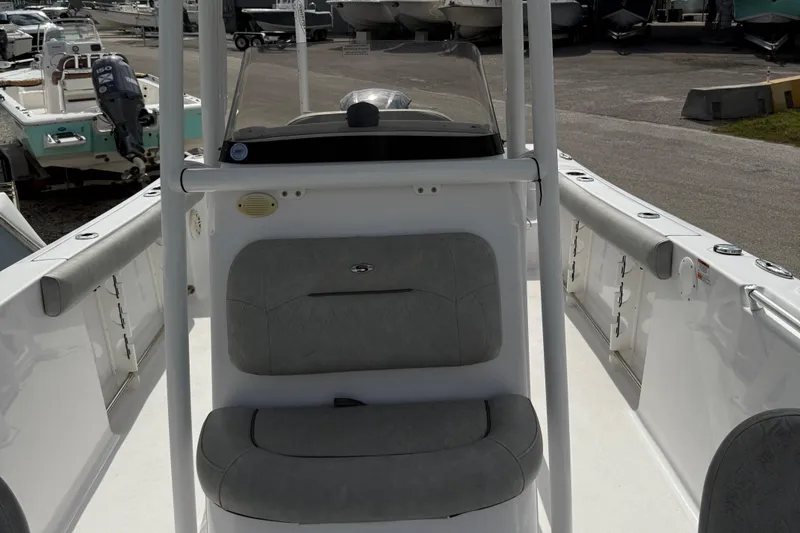 Slide: The Image of 2020 Sportsman Open 232 Center Console boat interior with seating and console view. - 6