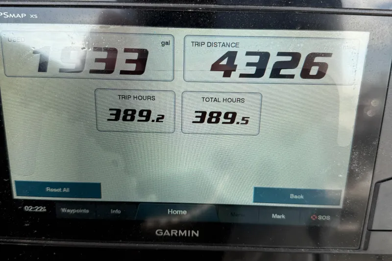 Slide: The Image of Display screen showing trip data on a Garmin device for a 2020 Sportsman Open 232 Center Console. - 9