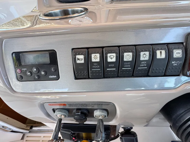 Slide: The Image of Control panel of 2009 Chaparral Signature 290 boat with various switches and buttons. - 10