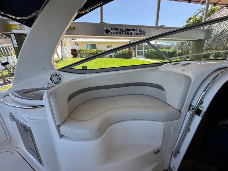Slide: The Image of 2009 Chaparral Signature 290 boat interior with white seating and window view. - 14