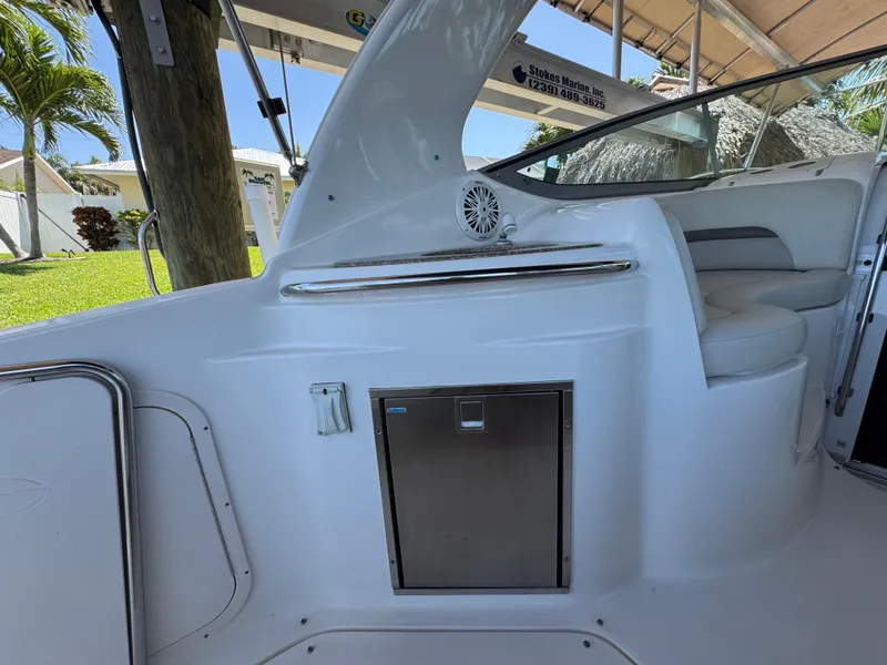 Slide: The Image of 2009 Chaparral Signature 290 boat interior with seating and storage compartment. - 16