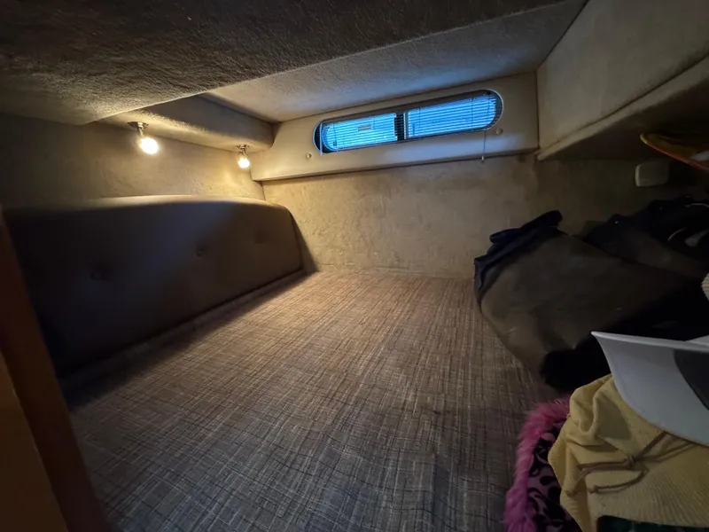 Slide: The Image of 2009 Chaparral Signature 290 cabin interior with cozy sleeping area and ambient lighting. - 26